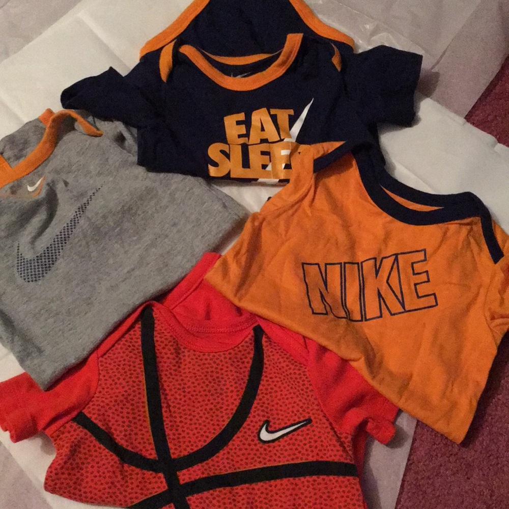 Size 9/12 month Nike onesies for little boys